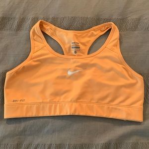 Nike sports bra in size large. Yellowish orange and racer back